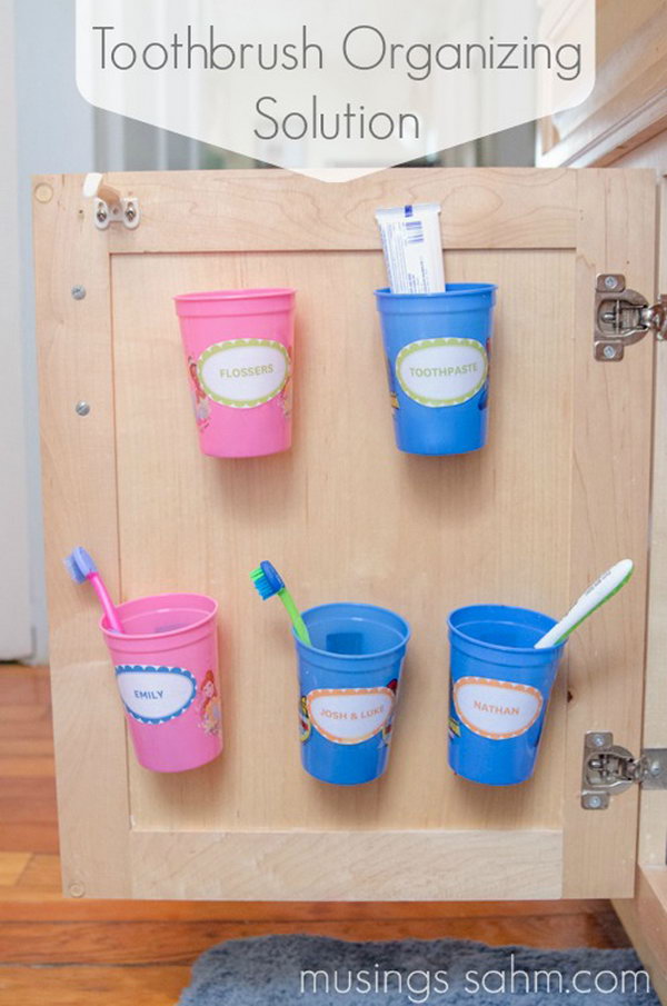 Install These Cups Behind The Cabinet Door To Organize Your Toothbrushes. 