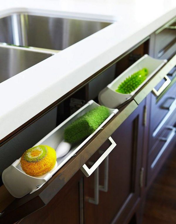 Use Hidden Pull-Out Panel Below Kitchen Sink to Store Sponges and Accessories. 