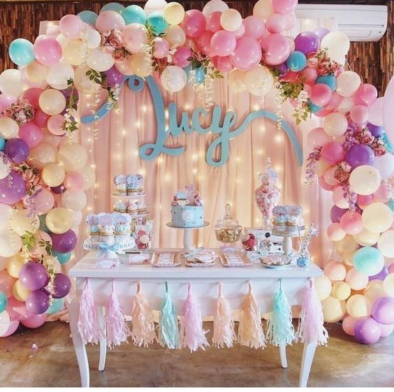 Gorgeous Balloon Arch and Tassel Garland Decorated Table. 