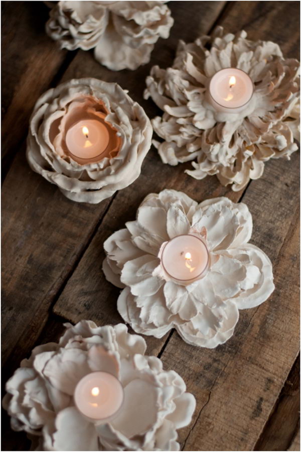 DIY Romantic Plaster Dipped Flower Votives. I can't believe how easy it is to make these beautiful flower votives at home. Tutorial via