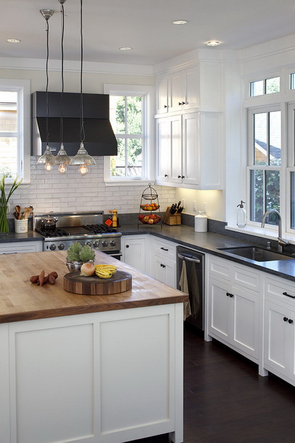  White Cabinets with Black Soapstone Countertops and Butcher Block Wood Island Countertops. 