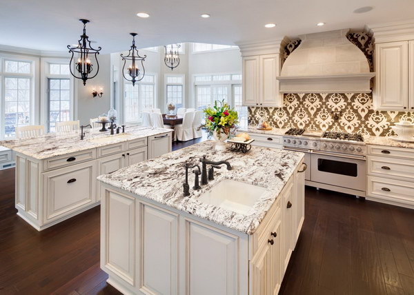 Luxurious All White Kitchen With Graphic Backsplash and White Carrara Granite Countertops. 