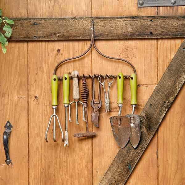 Repurpose Your Old Fork as the Storage of  Garden Tools. 