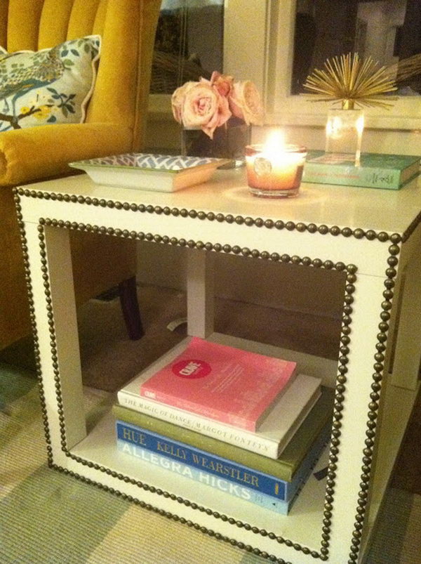 This awesome nailhead trim side table was made with two Lack tables which were assembled to match the form with a solid base. 