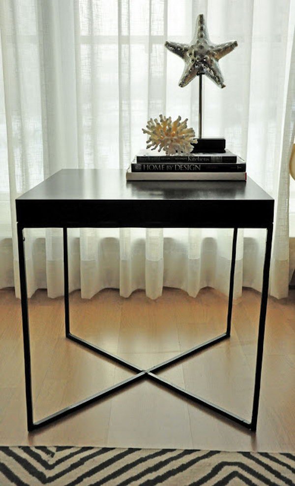 This creative welded table was made with the wood tabletop from an IKEA LACK table and the X-shaped metal frame as the table legs. 