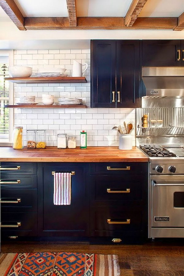 Navy Painted Cabinets with Wood Countertop and Brass Hardware. 
