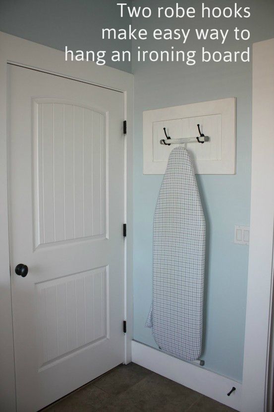 Two Robe Hooks Make Easy Way to Hang an Ironing Board. 