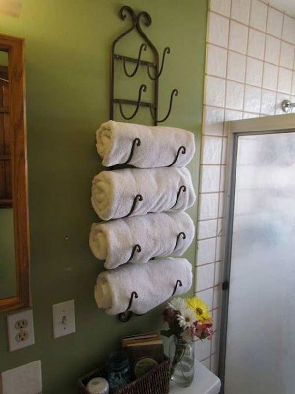 Wine Rack Used As A Towel Rack Over The Toilet. 