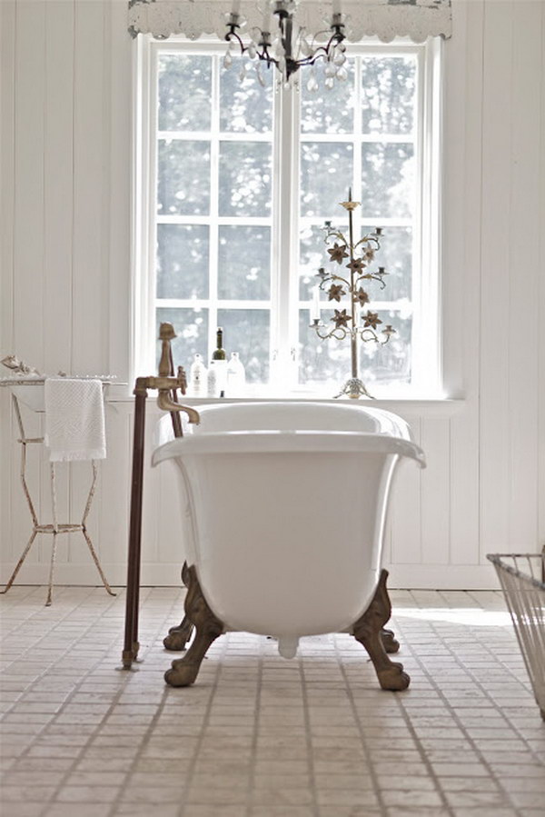 All White Shabby Chic Bathroom With A Tub In The Middle