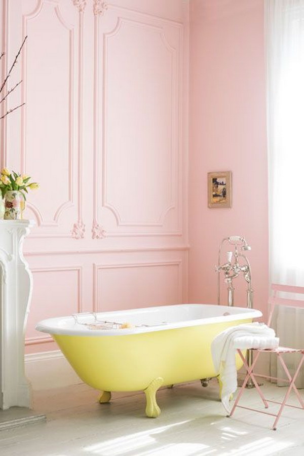 Pink Bathroom With Yellow Roll-Top Bath 