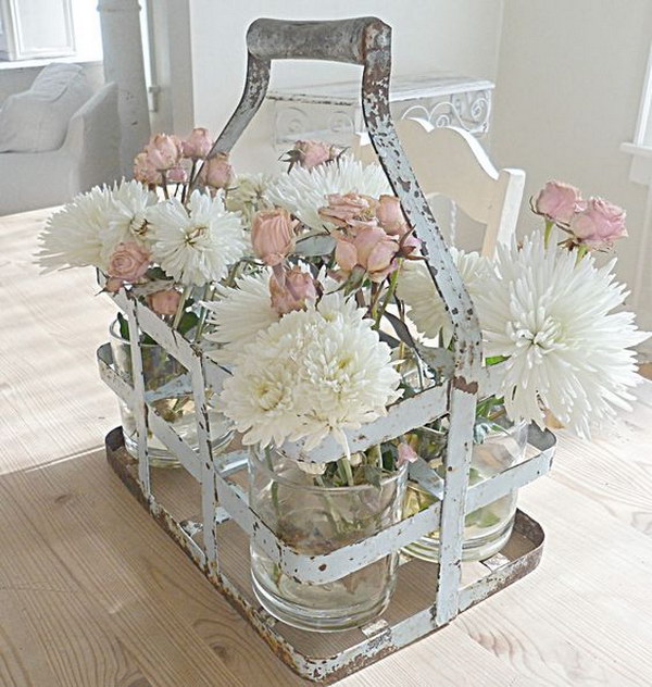 Old Milk Jug Carrier Using To Hold Mason Jars With Flowers For Table Decor 