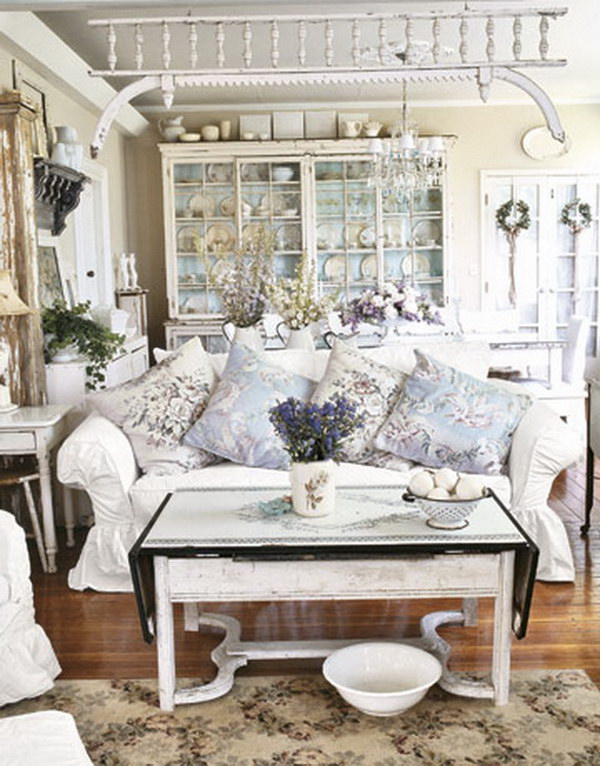 Shabby Chic Living Room Decorated with Antique Finish White, Floral Fabrics Ceramics and Tableware 