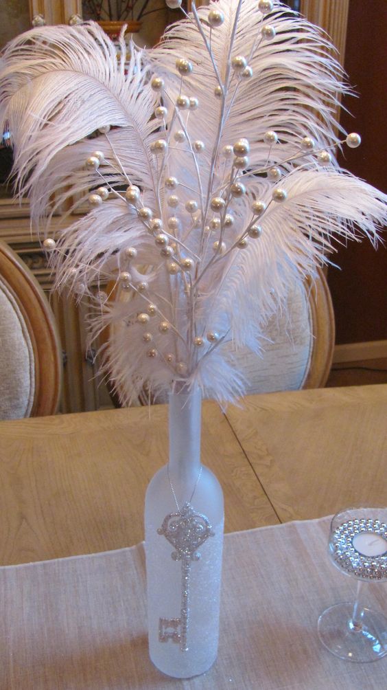 Beautiful Wine Bottle Decor With Glitter, Beads, Feathers, And Key Ornament. 