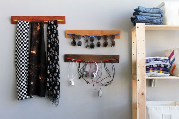 DIY Wooden Bungee Organizer. See the tutorial 