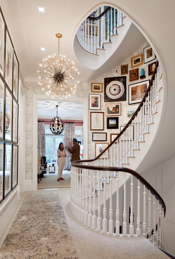 Chic Spiral Staircase With Gallery Wall. 