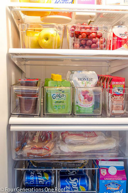 Organize your fridge with clear bins. 