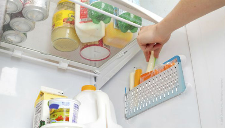 Hang suction baskets on the side of the fridge.. 