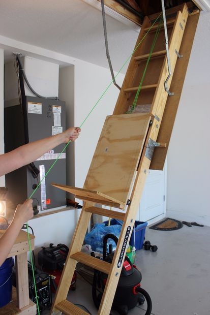 Make a Attic Storage Assistance by Using a Pulley System to Help Loadupthe Attic Ladder. 